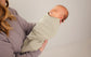 Close-up of the ultra-soft cotton fabric of LullaBaby Swaddle in Desert Sage